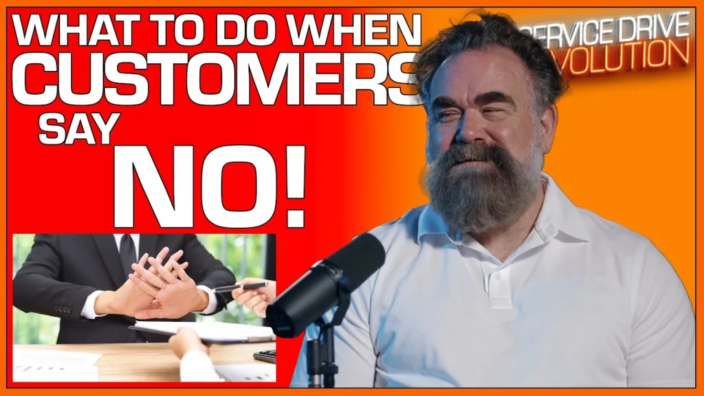 speaking into microphone with topic on handling customer objections.